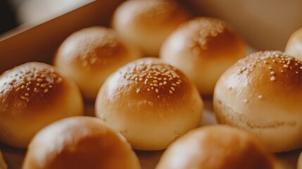 Freshly Baked Golden Bread Rolls with Sesame Seeds in a Rustic Bakery Setting