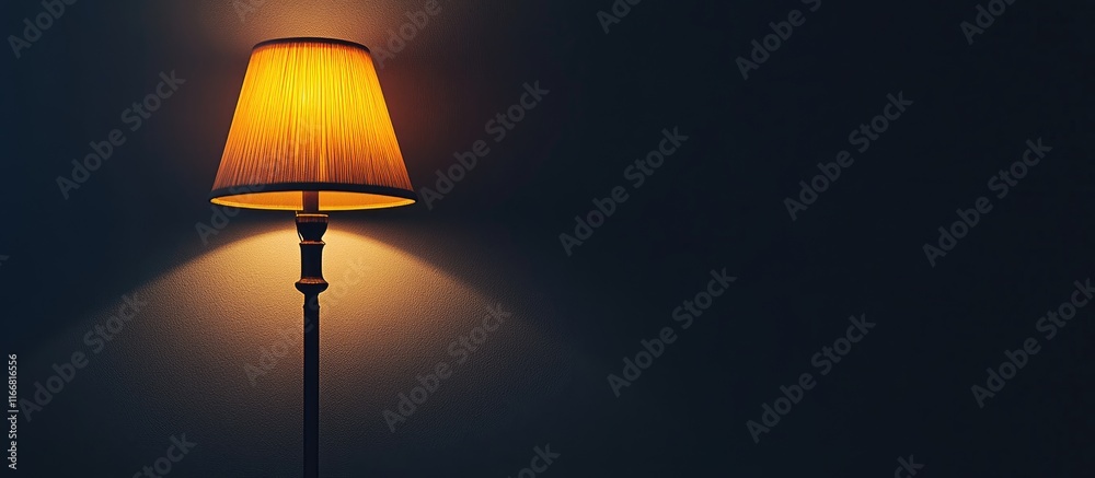 Poster Cozy illuminated lamp creating a warm ambient glow against a dark background enhancing a relaxing atmosphere at home