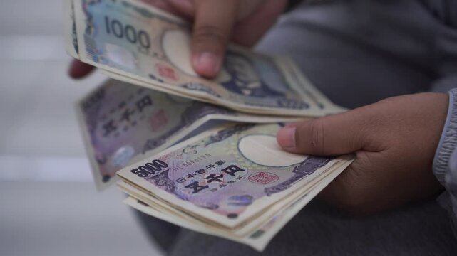 JPY money Japanese Yen banknote Counting in Business people hands for paying shopping salary or payment services, Cash Tax, saving cash for economy finance bill