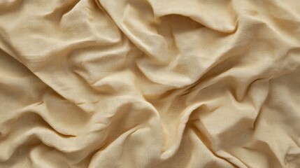 Wrinkled cotton fabric backdrop with soft textures in warm neutral tones for creative design projects and photography backgrounds