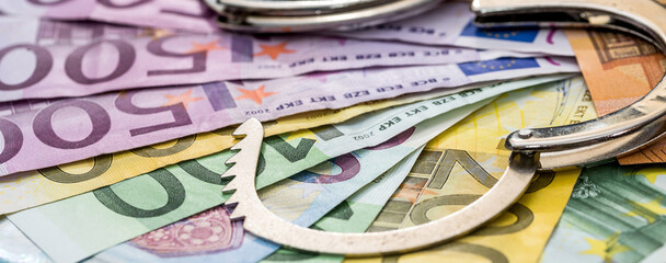 Police handcuffs with euro EU money