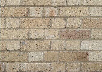 Close up of brick wall. The bricks are beige in colour