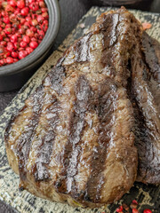 Grilled beef steak with salt, spices and herbs
