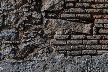 Weathered stone and brick wall texture with Sicilian architectural details