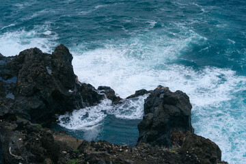 View of Charco De La Laja, a natural volcanic pool located along the rugged coast of Tenerife, Canary Islands. Crystal-clear pool, waves crashing against. hidden gem offers a serene retreat for swim