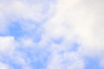Cloud cover with a few blue cloudless patches, sky with many clouds and blue background