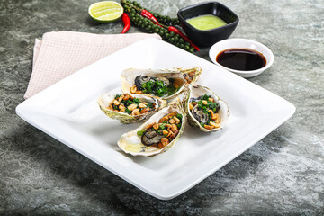 Open half oysters with green onion