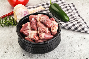 Fresh raw chicken hearts in the bowl