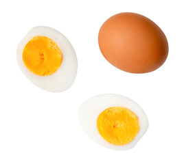 Top view set of raw chicken egg and cooked or boiled egg with egg yolk in two halves isolated on white background with clipping path