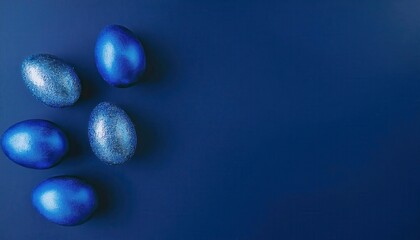 Vibrant Blue Glittery Easter Eggs on Deep Blue Background. Aesthetic Decoration Idea for Festive Easter Themes, DIY Craft Inspiration, or Social Media Posts Featuring Elegant Holiday Vibes