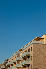 modern apartment building under blue sky
