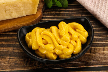 Yellow cheese sauce in the bowl