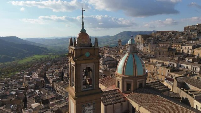 flying clockwise around bell tower of church in Caltagirone Sicily