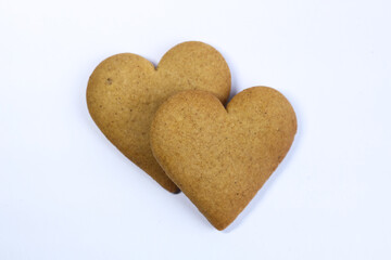 Two heart-shaped cookies on a white background. Isolated.