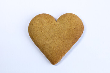 Heart shaped gingerbread cookie isolated on white background