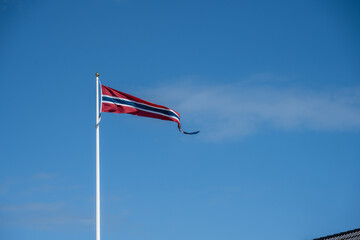 Norwegian national flag waving in the wind.