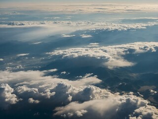 blue sky clouds top view in sun rays space atmosphere as serene background