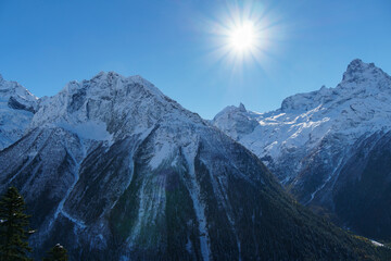 Picturesque landscape in Dombay with amazing snow-capped peaks and majestic blue slopes of North  Caucasus Mountains