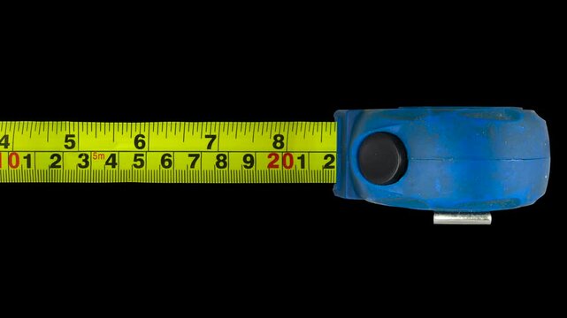 Looping video Of A Grungy Tape Measure Moving In And Out, With Alpha Channel