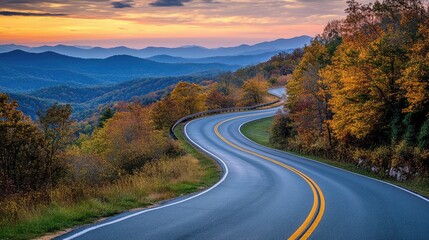 Fototapeta premium Mountain road at sunset. Beautiful curved roadway.
