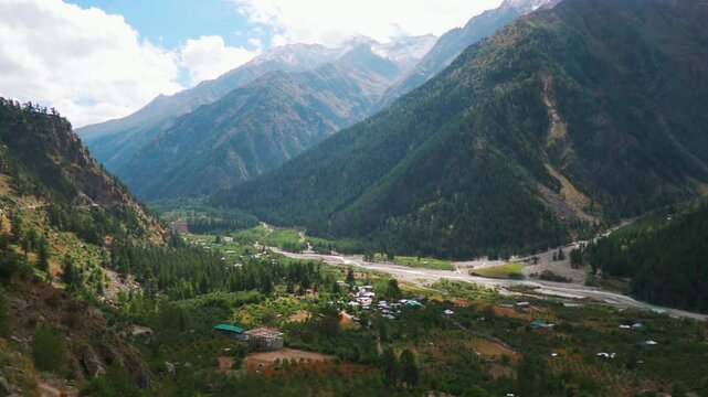 Scenic mountain valley, river and clouds at Sangla village in Kinnaur district, Himachal Pradesh. Heavenly mountain landscape. travel, tourism and holidays concept
