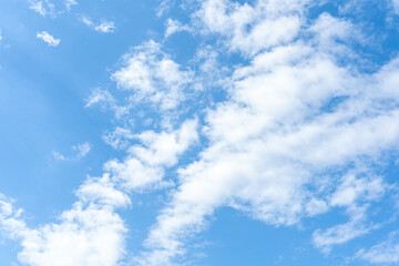 Blue Sky with Fluffy White Clouds Background Image