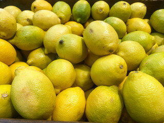 Yellow lemons in a crate at the store