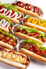 Assorted different hot dogs on a light background.