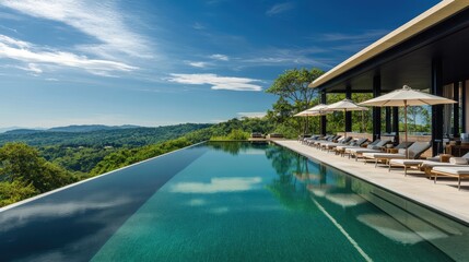 Obraz premium Rooftop infinity pool at a luxury hotel, offering sweeping views of the surrounding landscape and chic lounge areas