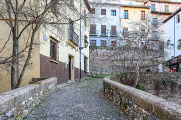 Narrow cobblestone street and building, Granada, Spain