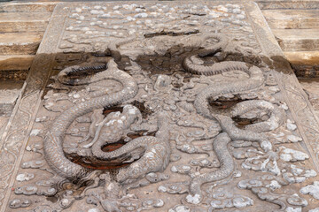 Dragon sculptures adorn the steps of the Forbidden City in Beijing, China