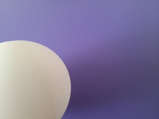 white ball on purple