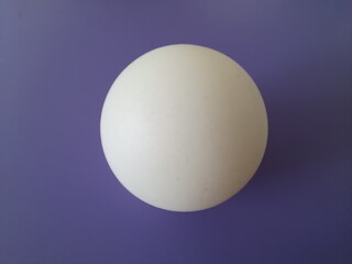 white ball on purple