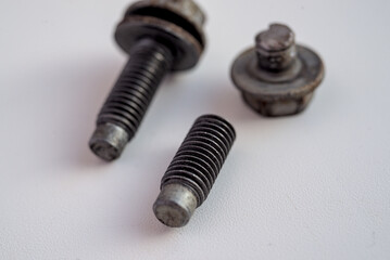 Broken and solid bolts on white background