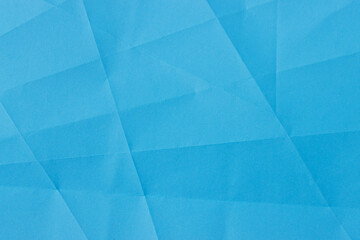 Abstract light blue crumpled paper texture background