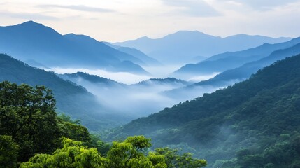 Majestic Mountain Range Shrouded in Ethereal Mist and Atmospheric Haze