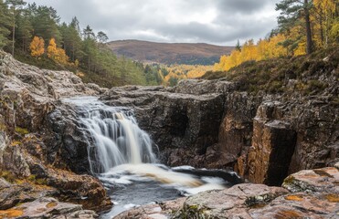 Obraz premium A serene landscape of the Scottish Highlands, featuring waterfalls and rocky terrain in autumn colors. The background features majestic mountains with soft light filtering through clouds, creating lon