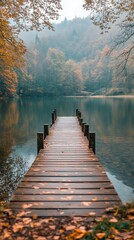 Fototapeta premium Tranquil wooden dock extending into calm lake at sunset surrounded by lush green trees