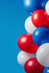 Colorful assortment of balloons on a blue background ready for a celebration