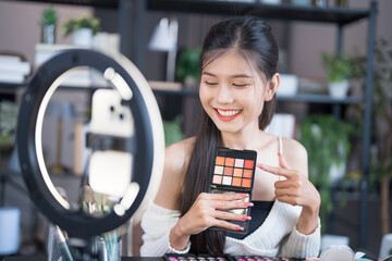 beauty blogger Young Asian girl makeup artist Professional Woman blogger vlogger is showing...