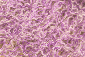 Tangled yarn background. Knitting problems. White and purple threads in chaos. Tangled colourful threads. Chaos concept. Violet and white needlework. Mix of woven yarn.