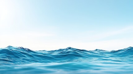 Fototapeta premium A serene view of calm ocean waves under a clear blue sky.