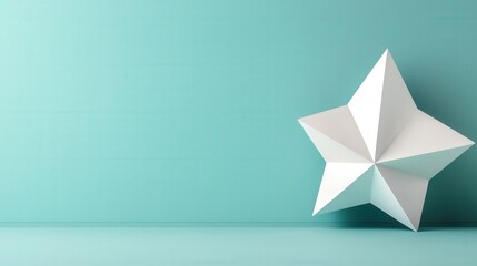 A minimalist paper star sculpture rests against a soft turquoise background, creating a serene and modern aesthetic.