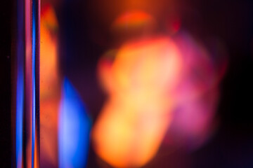 Colorful light leak on black background, abstract with optical lens flare shot on a true photo lens.