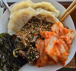 Korean food japchae and mandu with kimchi