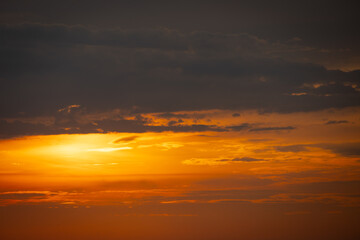 Obraz premium A serene seascape with a distant island silhouetted against the twilight sky