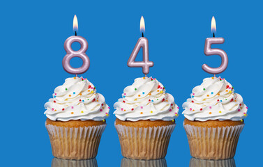 Birthday Cupcakes With Candles Lit Forming The Number 845