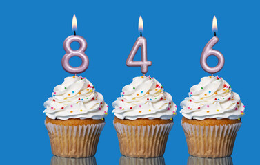 Birthday Cupcakes With Candles Lit Forming The Number 846