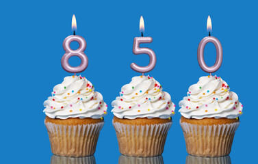 Birthday Cupcakes With Candles Lit Forming The Number 850