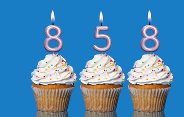 Birthday Cupcakes With Candles Lit Forming The Number 858